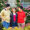 Photo of three people with trees behind them.