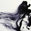 Droplet of ink squirted into water showing vortices and turbulence