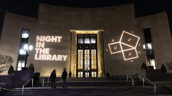 Photo of the entrance to the Brooklyn Public Library at night time.