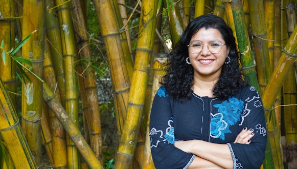 Portrait of Abhilasha Joshi taken in the gardens at the National Centre for Biological Sciences, Bengaluru, India.