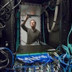 Ian Fisk reaching up to some wires