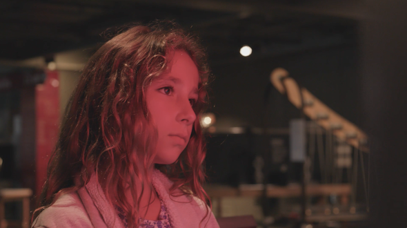 Photo of a young girl in red light.